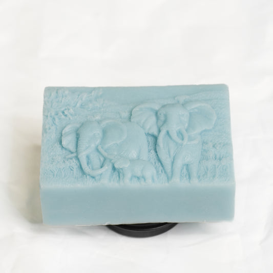 Light blue soap bar with elephant design on a white background